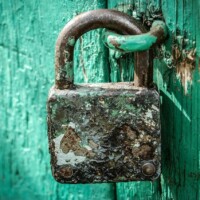 #image_title Rusty Padlock On Blue Door ALT